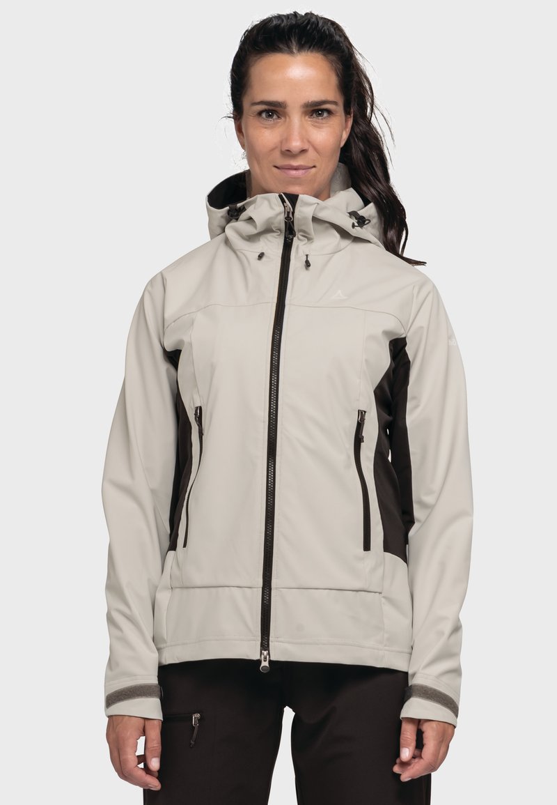 Hellgraue Softshell-Jacke mit Kapuze, dunkelbraunen Akzenten, Reißverschlusstaschen an den Seiten und verstellbaren Bündchen für eine sichere Passform.