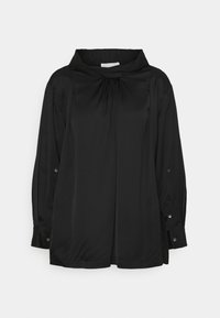 Blouse noire à manches longues avec encolure froncée, poignets boutonnés, coupe ample et col montant.