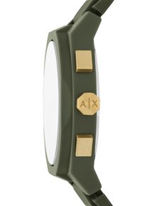 Orologio in silicone verde con quadrante bianco, pulsanti color oro e un accento esagonale. Presenta un design robusto e angolare per garantire durabilità.
