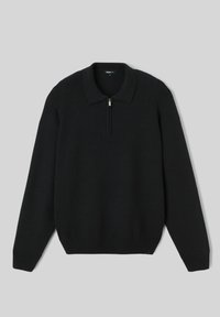 Pull en tricot noir à manches longues avec col et courte fermeture éclair frontale, posé à plat sur un fond gris clair.