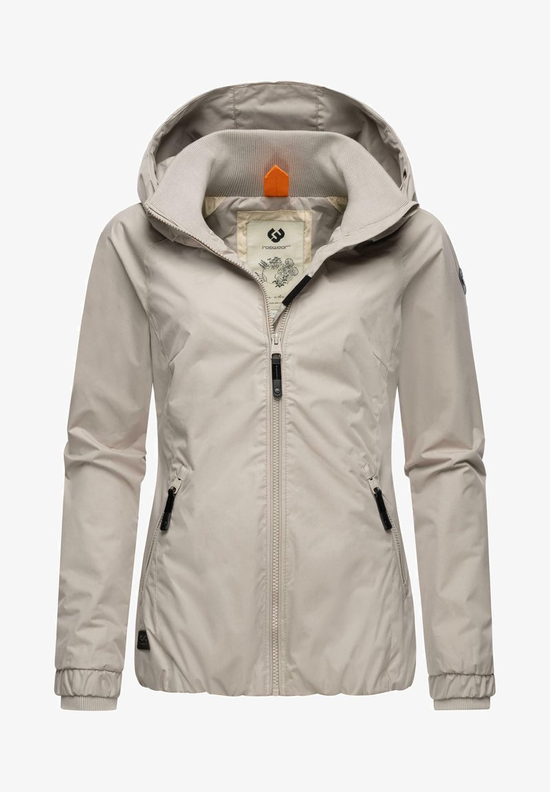 Helebeež värvi jakk, millel on kapuuts, esipaneelil tõmblukk, kaks küljetaskut, soonilised varrukad ja mustriline vooder. Kapuutsil on oranž aktsent.