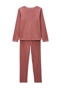 Haut à manches longues côtelé et pantalon assorti en rose poussiéreux avec un col rond et des détails de couture contrastants. Matière en coton douce.