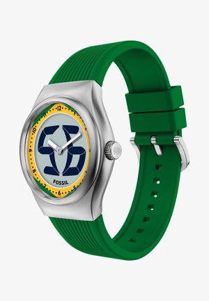 Orologio da polso analogico con cinturino in silicone verde, cassa argento, quadrante giallo e verde con numeri neri e lancette bianche per ore e minuti.
