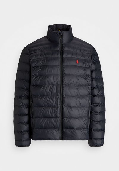 Black puffer jacket with a high collar, featuring quilted texture and a front zipper. Notable red logo on the chest, two side pockets.