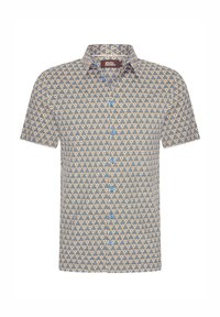 Korte mouwen shirt van een geblokt stof met geometrische vormen, blauwe accenten en een knoopsluiting aan de voorkant. Voornamelijk in crèmekleurige en marineblauwe tinten.