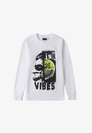 White long-sleeve t-shirt featuring a graphic design with a masked face, green circle, and text "ink VIBES" in black. Cotton material.
