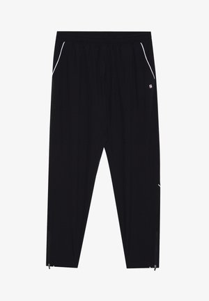 Calças atléticas pretas com um corte relaxado, cintura elástica, bolsos laterais e detalhe em piping branco. Apresenta bainhas com fechos de correr nos tornozelos.