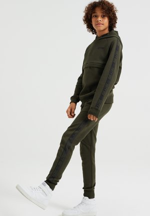 MET TAPEDETAILS - Trainingsbroek - green