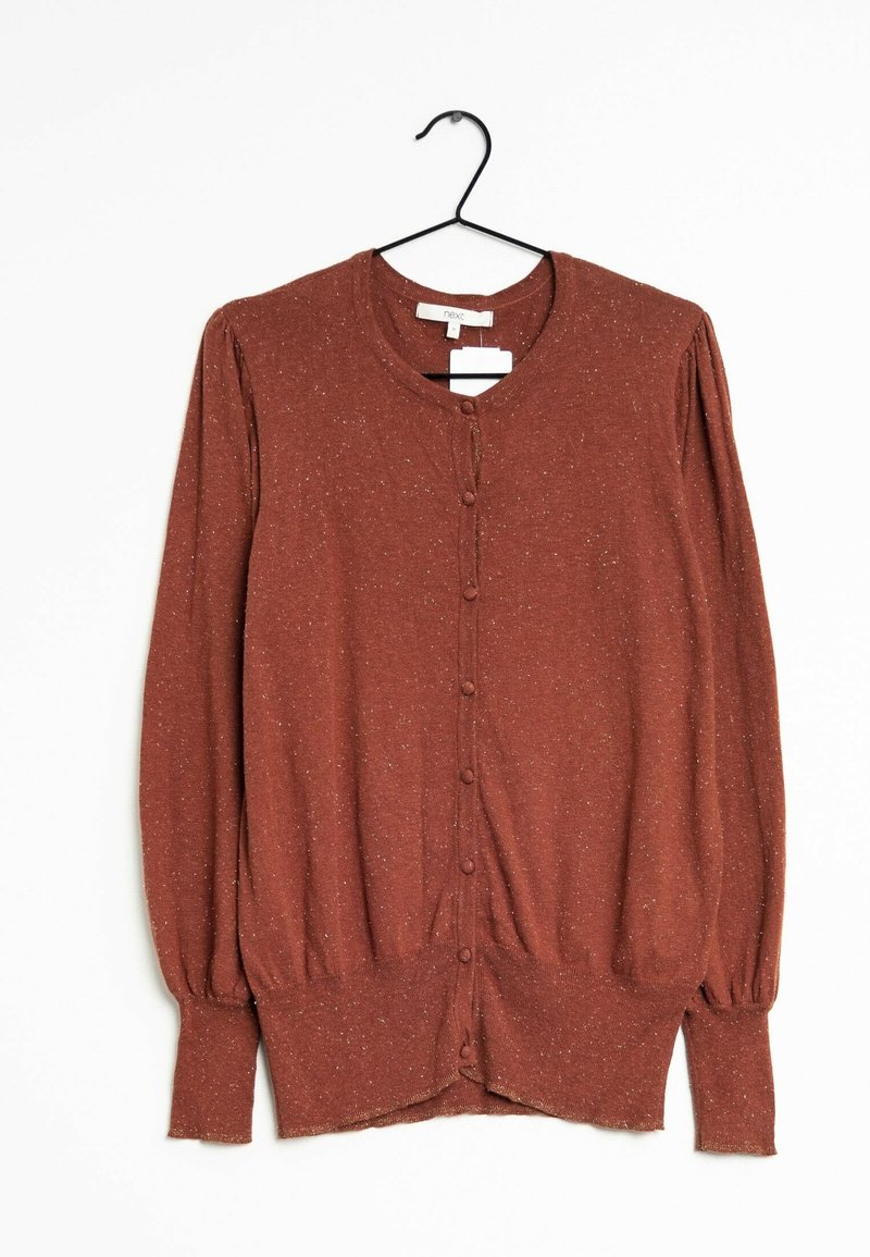 Cardigan à manches longues couleur rouille tacheté avec des boutons sur le devant, présenté sur un cintre noir sur fond blanc.