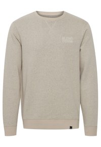 Světlé béžové mikina z bavlněné směsi. Má žebrovaný kulatý výstřih, nenápadné vyšívané logo "BLEND DENIM" a žebrované manžety a spodní lem.