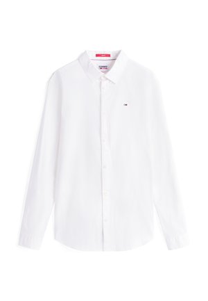 Chemise blanche ajustée à manches longues avec col et petit logo Tommy Jeans sur la poitrine gauche.