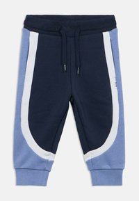 Σκούρο μπλε και ανοιχτό μπλε παντελόνι φόρμας με βουρτσιστή υφή, που διαθέτει λευκές πλευρικές λεπτομέρειες, ελαστική μέση και ριμπ τελειώματα.