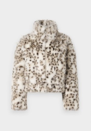 Cropped fur jacket in cream with dark spots, featuring a high collar and long sleeves. A front zipper detail and soft texture are notable.