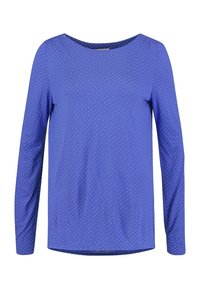 Långärmad topp i klarblått tyg med vita prickar. Rund halsringning och något förlängd bakre fåll, med en mjuk yta.