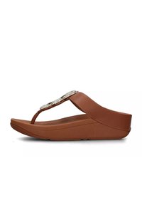 Sandalo con tacco a trapezio marrone con una fascia in pelle liscia e dettagli di strass decorativi sulla tomaia. Soletta sagomata per il comfort.