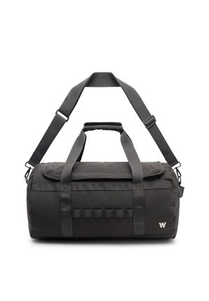 Sac de sport cylindrique noir avec double poignée, bandoulière réglable et petit logo blanc en bas à droite.