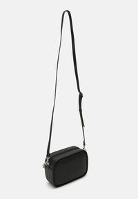 Black rectangular crossbody bag made of smooth material, featuring an adjustable strap and silver hardware accents. Simple design, no patterns.