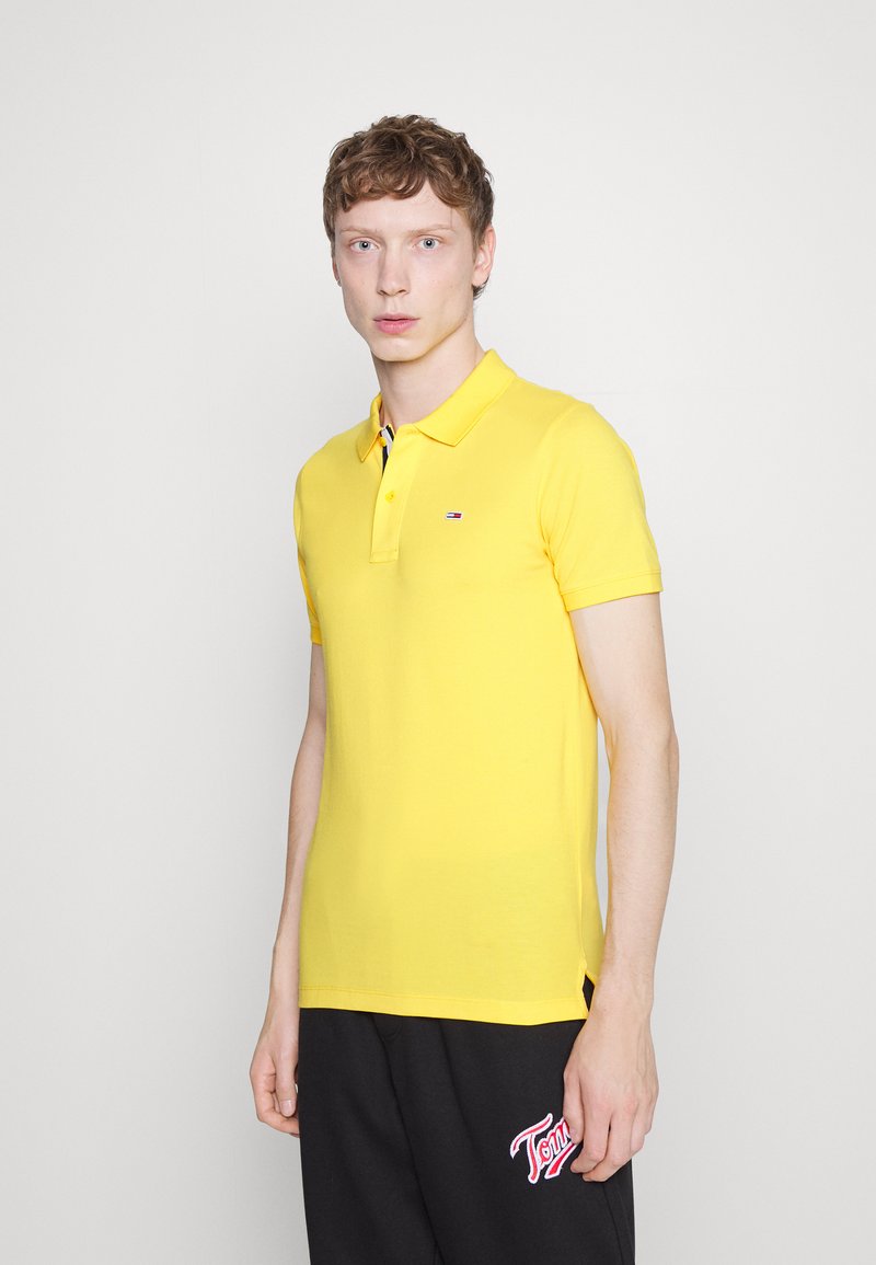 Tommy Jeans SLIM PLACKET Polo shirt warm yellow/yellow Zalando.co.uk