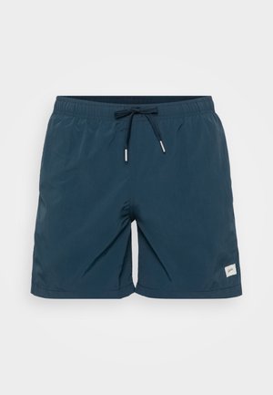 Marineblauwe zwemshorts van lichtgewicht materiaal, met een elastische tailleband met trekkoord en een klein logo-opdruk aan de zijkant.