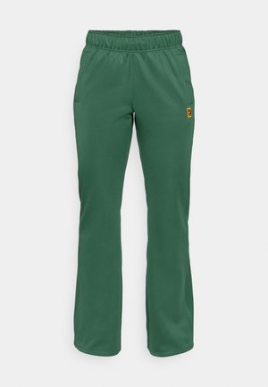 Groene sportbroek met een elastische tailleband, twee zijzakken en een slim fit ontwerp. Gemaakt van zacht materiaal met een subtiele textuur.