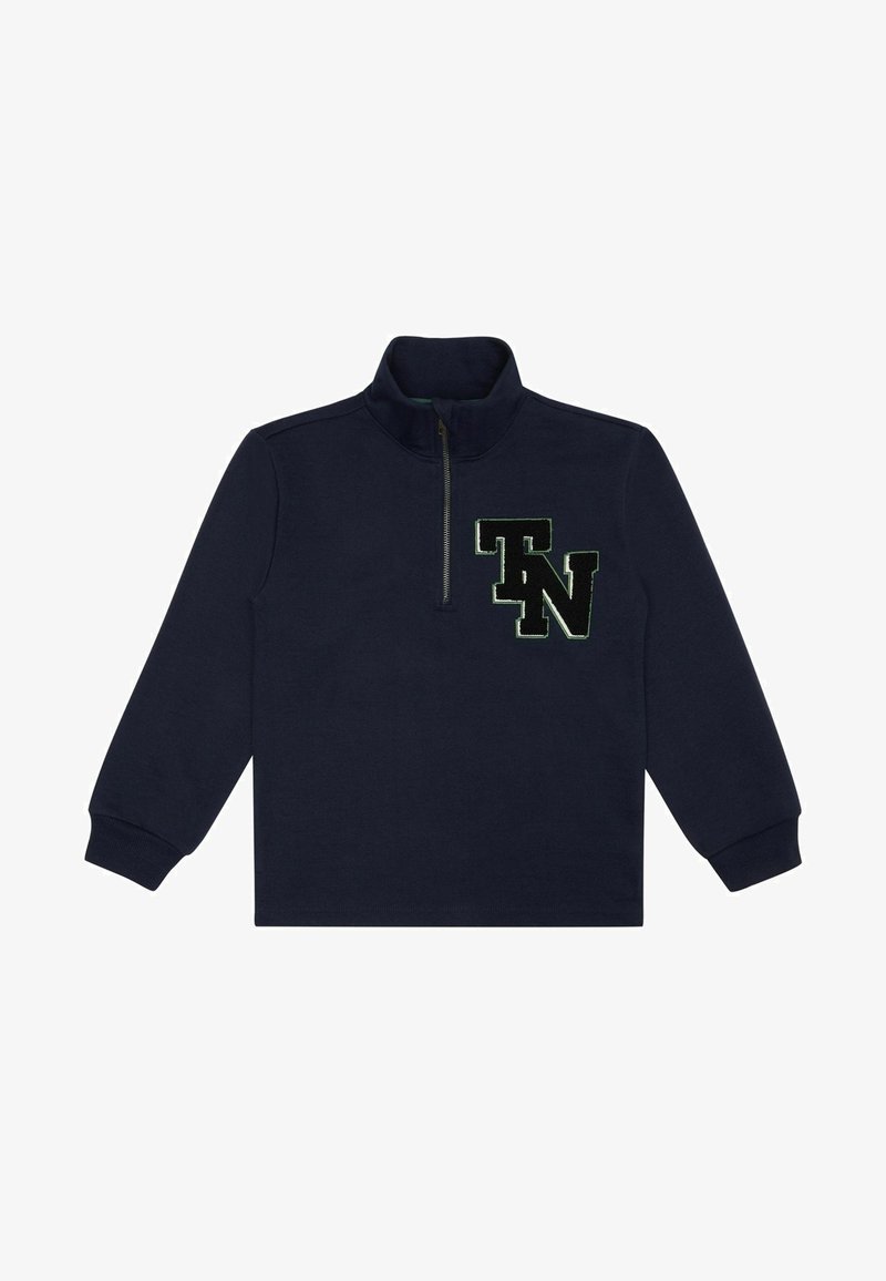 Sudadera de cremallera en azul marino con cuello alto, mangas largas y un gran logo bordado en negro y verde "TN" en el pecho. Textura de tela suave.