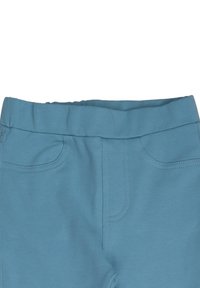 Hellblaue Hose mit weicher Textur, ausgestattet mit einem breiten elastischen Bund, vorderen Taschenstich-Details und einem glatten Finish.