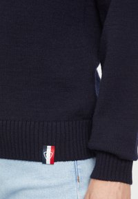 Rossignol Sweter