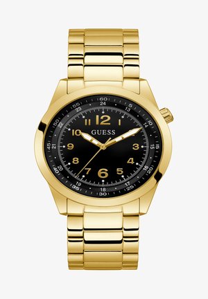 Montre en acier inoxydable doré avec un cadran noir, présentant de grands marqueurs horaires dorés, une fonction date et un bracelet à maillons.