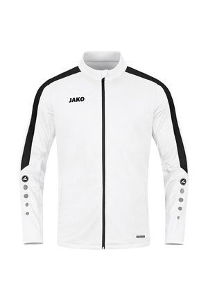 Witte sportjack met zwarte accenten, hoge kraag, volle rits en unieke knoopdetails op de mouwen. Bevat het "JAKO" logo op de borst.