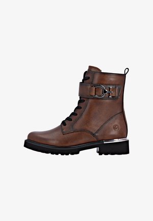 Brown leather ankle boot with black laces and a buckle strap. Features a textured finish, chunky black sole, and metallic accent on heel.