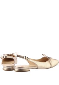 Gold metallic slingback shoes with a flat heel and a bow detail on the back; smooth texture and open toe design. Adjustable ankle strap.