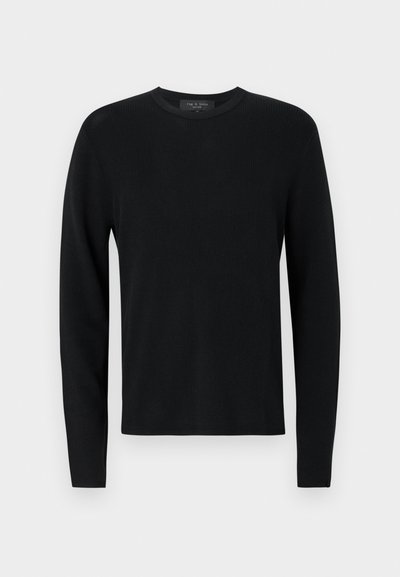 Pull longs en coton noir avec une texture côtelée, col rond et manches ajustées. Design uni sans motifs ni accents.