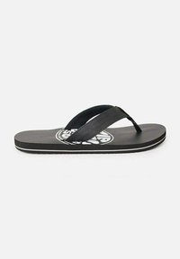 Black flip-flop with textured sole, thin black straps, and a circular logo printed on the insole. Slim white accent along the edge.