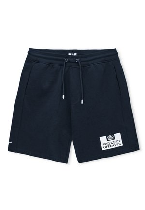 Short noir avec cordon de serrage, poches latérales et un patch blanc sur la jambe gauche avec l'inscription "WEEKEND OFFENDER" sous un symbole de couronne.