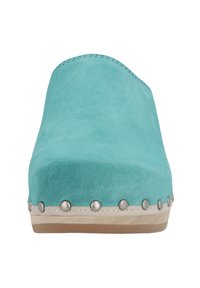 Turquoise suede clogs with a rounded toe, accented by metal studs around the base and a light-colored sole. Smooth texture, minimalist design.