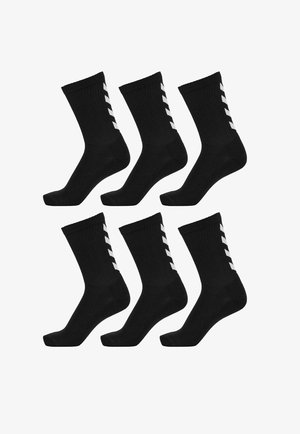 Schwarze Baumwollsocken im Sechserpack, mit weißen Zickzackakzenten an der Außenseite, gerippter Textur und klassischem Knöchellängen-Design.