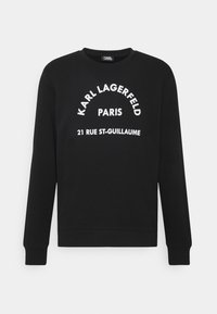 Felpa nera a maniche lunghe con testo bianco che recita "KARL LAGERFELD PARIS 21 RUE ST-GUILLAUME" sulla parte anteriore.