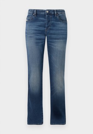 Tumedast sinisest denimist teksad otse jala kujundusega, esikottide, tagasihoidliku kulumise ja klassikalise nööbi sulgemisega vööl.