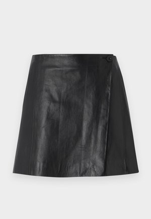 Black faux leather mini skirt with wrap front detail secured by a button on the right side, smooth texture, and slight sheen.