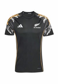 Černý sportovní dres s krátkými rukávy, s žlutými akcenty a vzorovaným designem na ramenou. Vyrobeno z materiálu odvádějícího vlhkost.