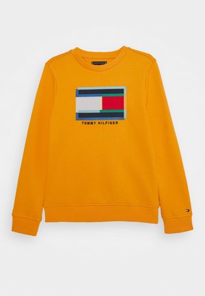 Oranges Sweatshirt mit einem bunten geometrischen Logo auf der Vorderseite. Gerippte Bündchen und Saum, aus weichem Baumwollstoff gefertigt.