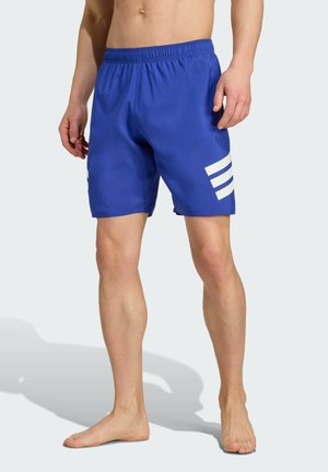 Blaue Schwimmshorts mit elastischem Bund, versehen mit drei weißen Streifen auf der linken Seite. Hergestellt aus leichtem Material.