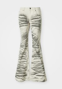 Light-colored flared jeans with textured black horizontal stripes and wrinkled detailing, featuring front pockets and metal button closure.