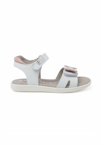 Sandalias blancas con acentos rosas, tiras de velcro y detalles de flores en capas. Fabricadas con material sintético y suela texturizada para mayor agarre.