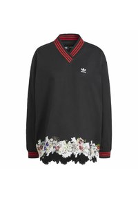 Mustat huppari V-purkauksella, punaraitaisella kauluksen reunalla ja kukkakoristeisella helmalla. Sisältää brodeerattuja yksityiskohtia ja logon.