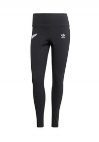 Leggings sportivi neri con vita alta. Presentano il logo bianco di Adidas e un design a foglia sulla coscia sinistra. Realizzati in un tessuto liscio e elastico.