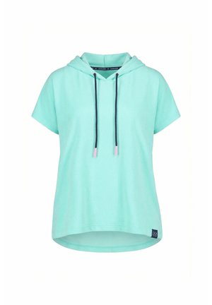 Mintunvihreä lyhythihainen huppari, jossa mustat kiristysnauhat, jotka päättyvät vaaleanpunaisiin pääteosiin, ja pieni musta logokyltti helman lähellä.