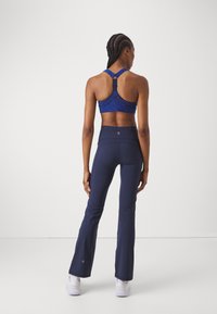 Sweaty Betty POWER BOOT CUT 2.0 WRAP WAIST - Treniņtērpa apakšdaļas - navy blue