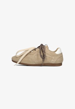 Beige suede sneaker with a textured pattern, cream laces, and a leopard print accent. Features a brown rubber sole and a white heel cap.