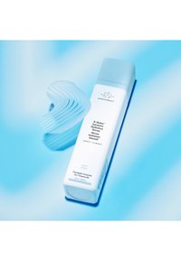 White bottle with light blue cap, labeled "B-Hydra Intensive Hydration Serum." Curved, textured blue applicator with wavy design alongside.
